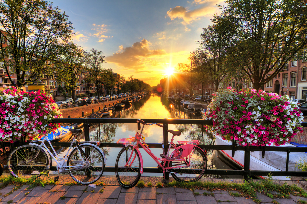Beautiful,Sunrise,Over,Amsterdam,,The,Netherlands,,With,Flowers,And,Bicycles