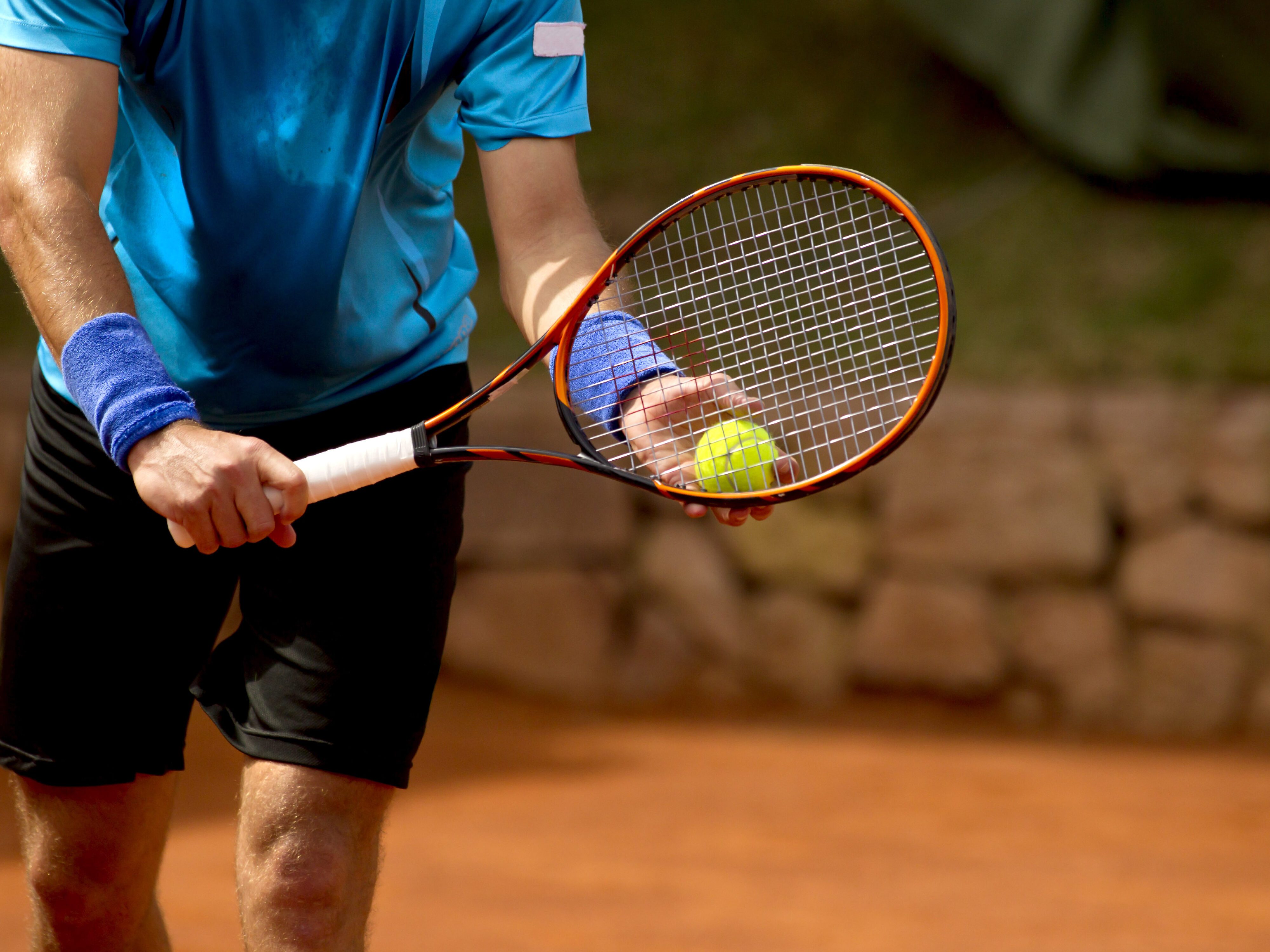 A,Tennis,Player,Prepares,To,Serve,A,Tennis,Ball,During