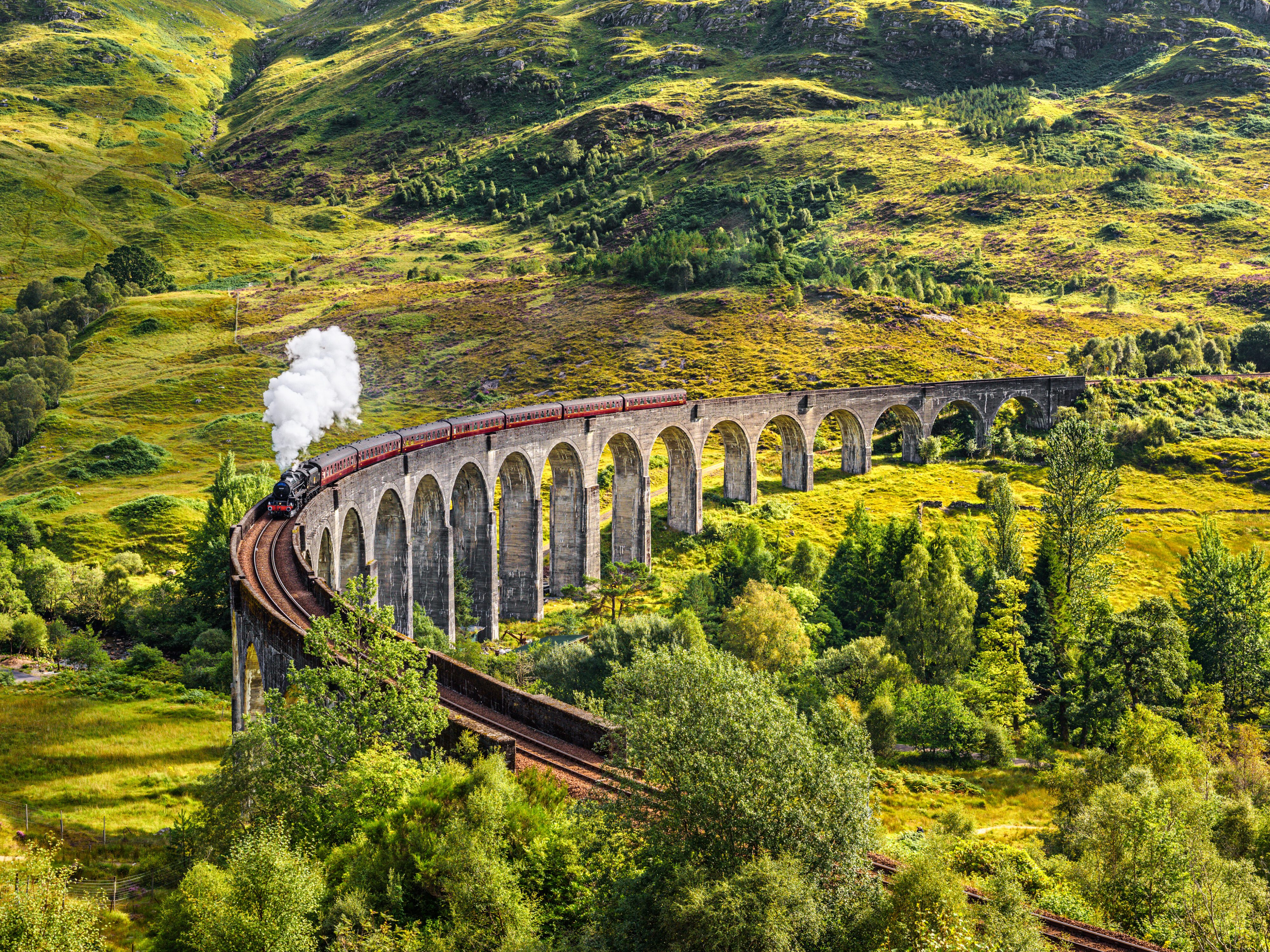 Glenfinnan,Railway,Viaduct,In,Scotland,With,The,Jacobite,Steam,Train