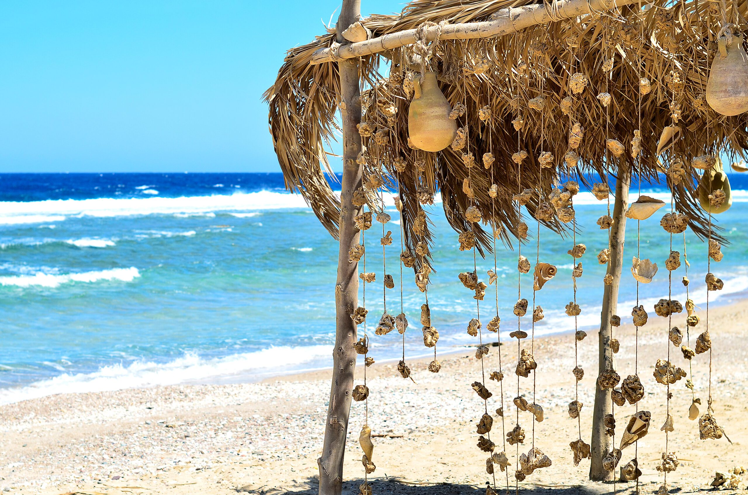 A,Carport,With,A,Garland,Of,Coral,And,Shells.,Red